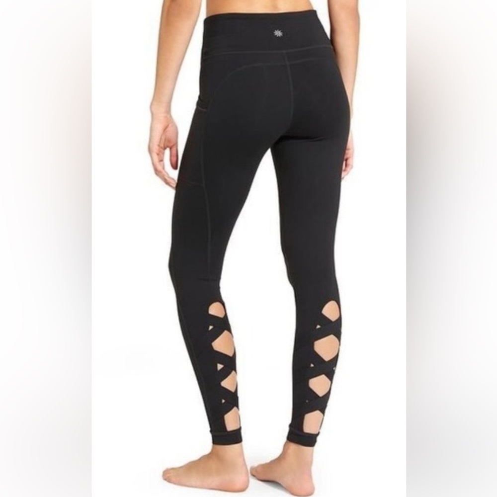 Cut Out Criss Cross Chaturanga Leggings by Athleta
